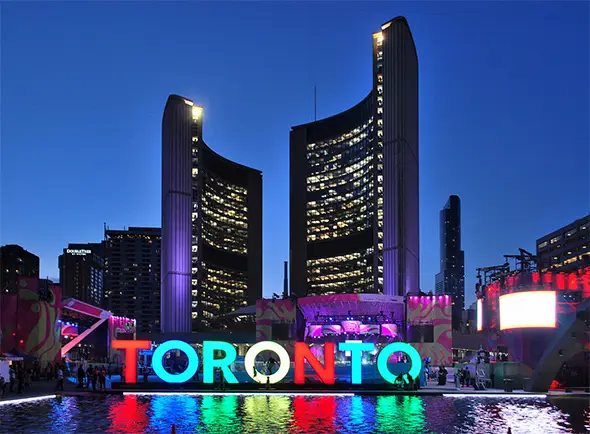 A photo of Toronto City Hall at night